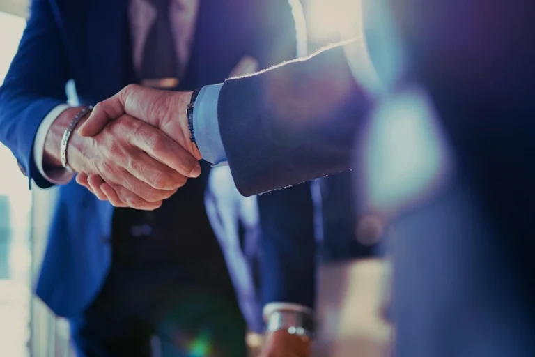 Corporate handshake representing Japan business matchmaking and B2B connections.