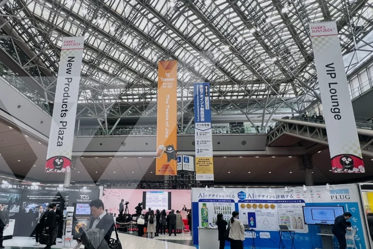 Dynamic view of Foodex Japan showcasing various trade show booths and banners.